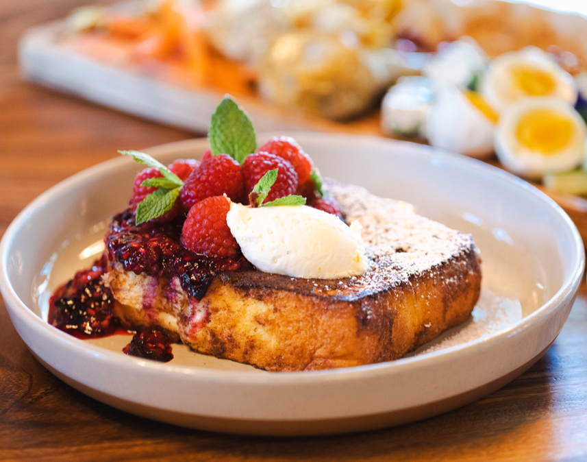 Brioche French toast with warm berry compote, whipped mascarpone and mint